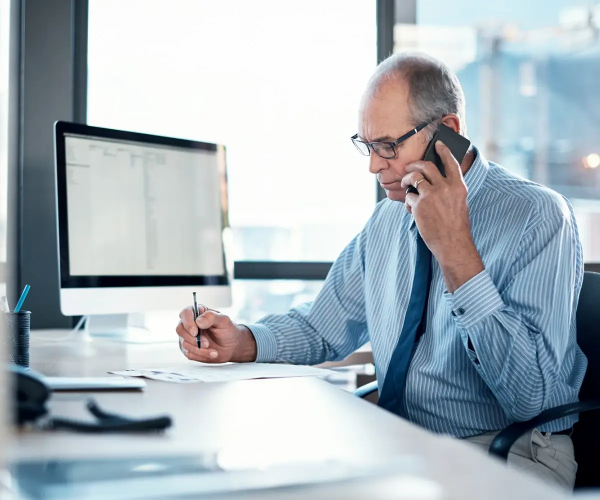 Lawyer looking over documents on the phone