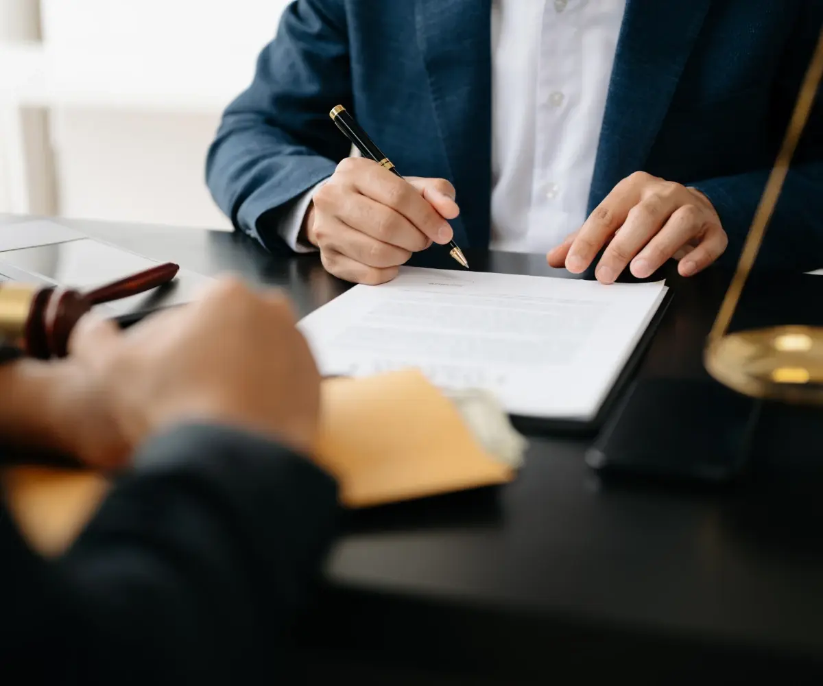 Lawyer signing a document