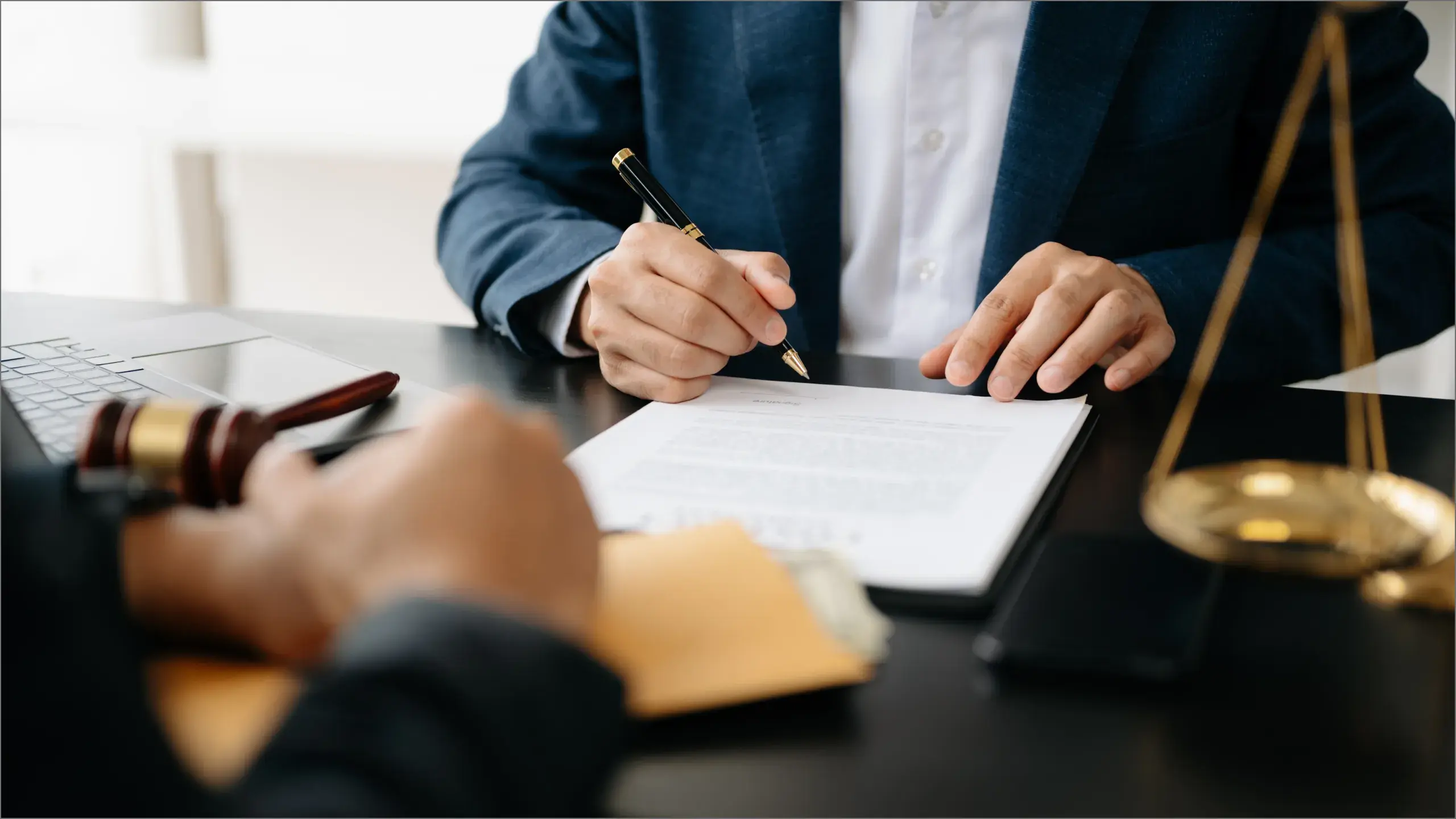Lawyer going over document in office